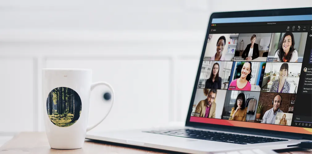 Image of a macbook on a table with Microsoft Teams app open